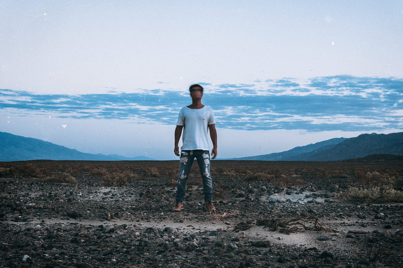 Sapphire Adizes standing in a desert landscape