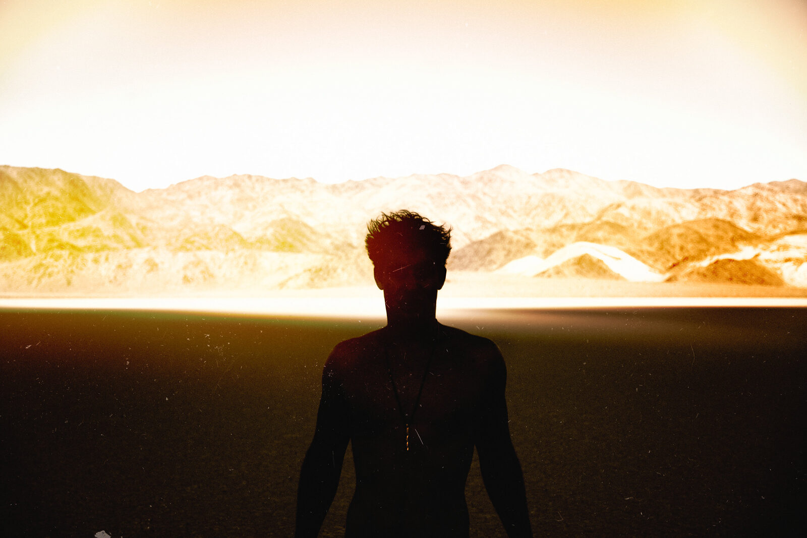 Sapphire Adizes backlit silhouette in golden desert light